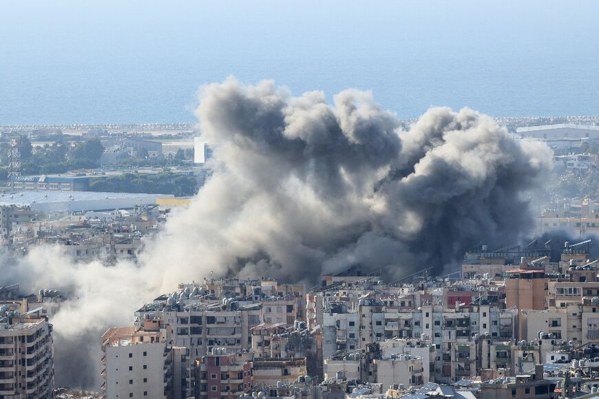 Smoke rises over south Beirut after an Israeli air strike on the Hezbollah stronghold.