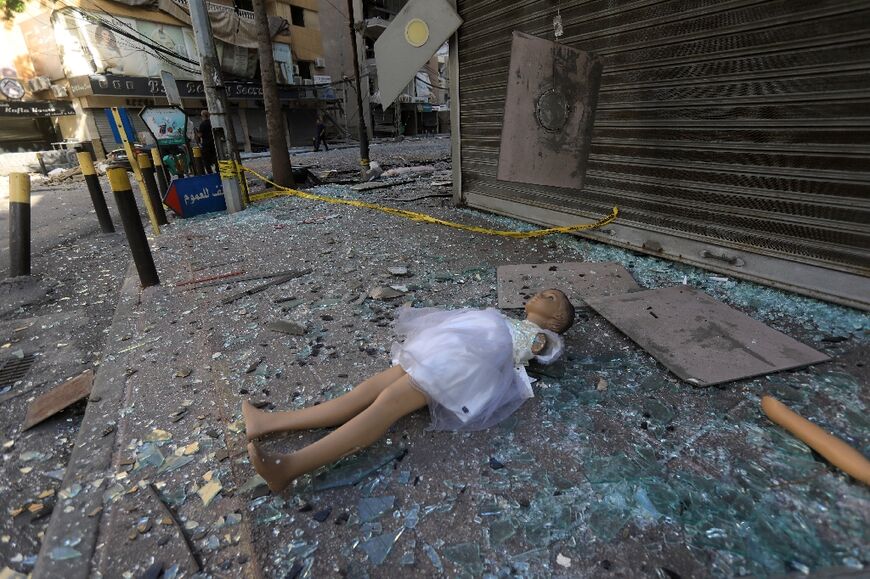 A manequin surrounded by glass shards following Israeli strikes on south Beirut