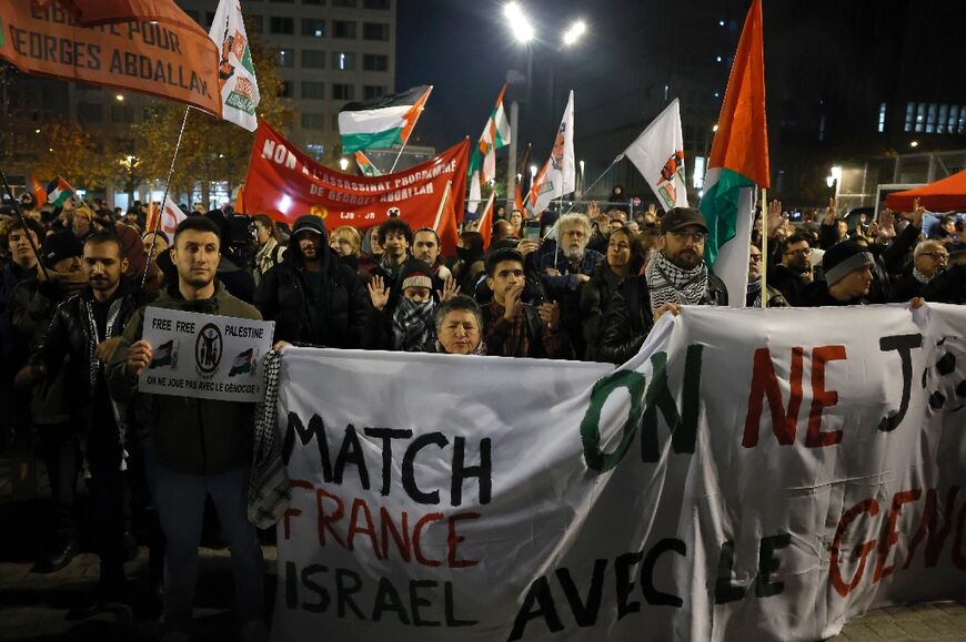 Pro-Palestinian protesters gathered near the Stade de France ahead of the match