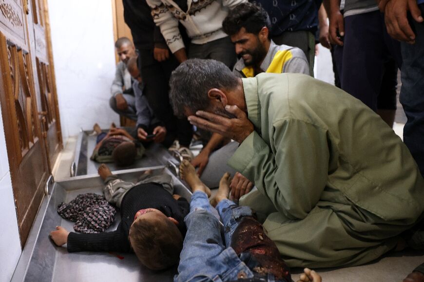 Palestinians at Nasser Hospital in Khan Yunis, southern Gaza, react in front of the bodies of children killed in an Israeli strike