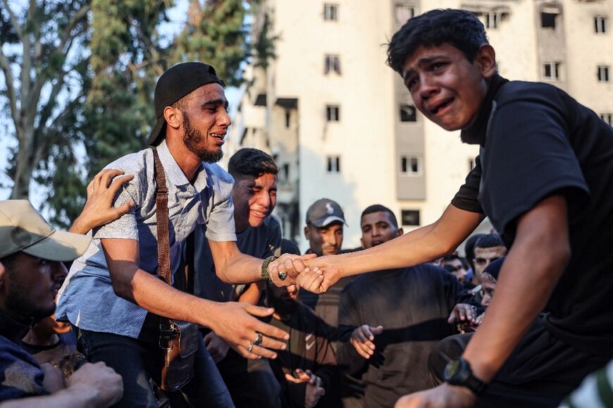 Palestinians at a Gaza City hospital after victims were transported there following an Israeli strike