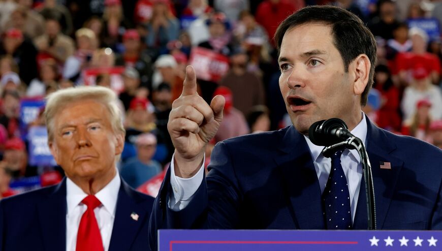 Republican presidential nominee, former U.S. President Donald Trump watches as U.S. Sen. Marco Rubio (R-FL) speaks during a campaign rally at the J.S. Dorton Arena on November 04, 2024 in Raleigh, North Carolina. 