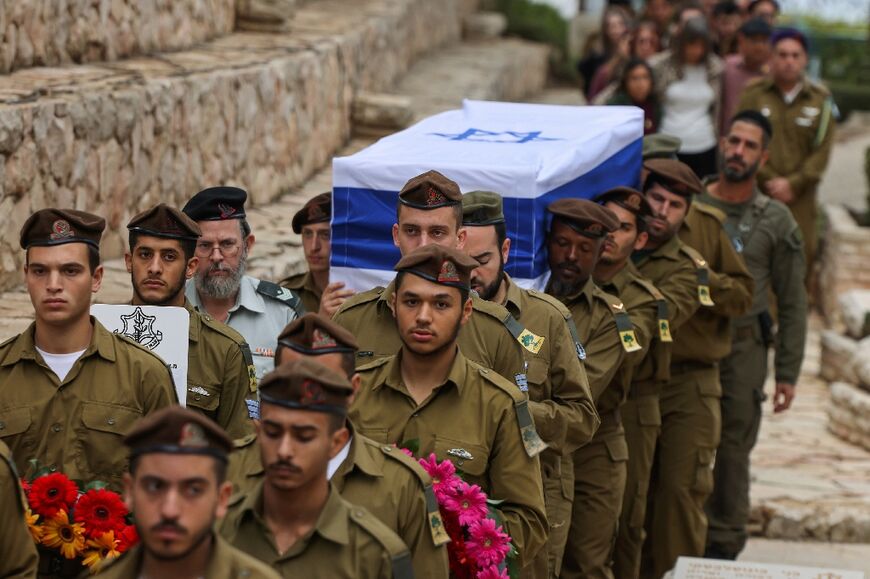 Israeli soldiers on Wednesday carry the coffin of one of their comrades who was killed in southern Lebanon