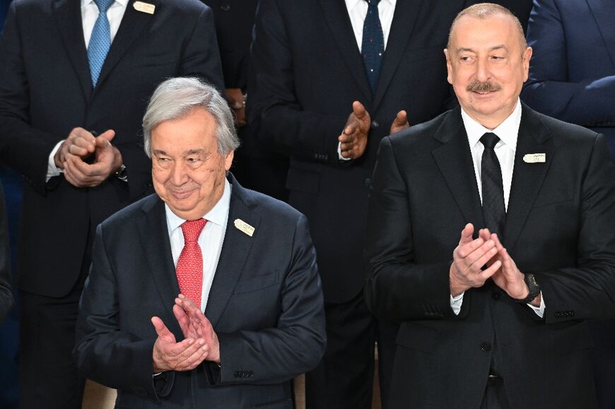 United Nations (UN) Secretary General Antonio Guterres and Azerbaijan's President Ilham Aliyev attend a family photo at COP29 