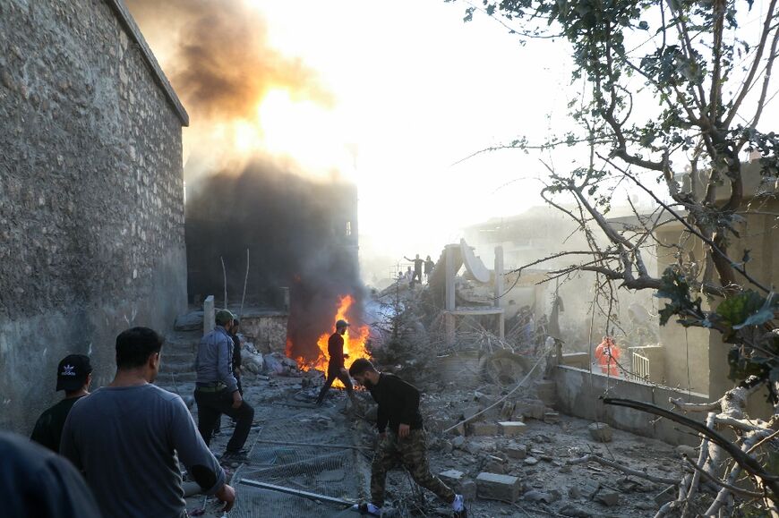 Residents and rescuers comb through rubble in Lebanon's eastern city of Baalbek after deadly Israeli strikes