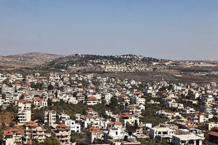 Thousands of Palestinian Americans live in West Bank villages including Turmus Aya, foreground, with the Israeli settlement of Shilo in the background