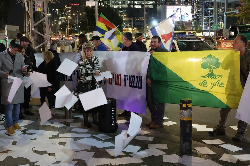 Demonstrators protest against a ceasefire in Lebanon in front of the Israeli defence ministry on Tuesday