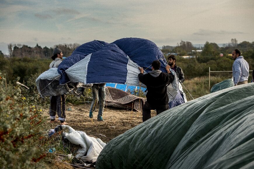 Syrian migrants set up a tent  in the 'Jungle' camp of Calais in October