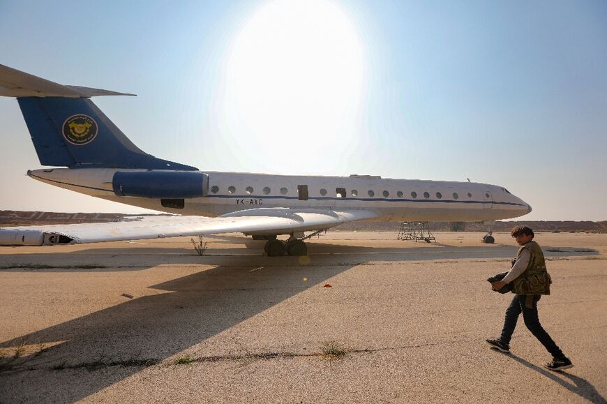 A Syrian government plane abandoned at the air base