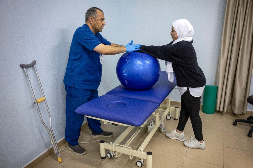 Physiotherapy for a Palestinian child injured in the Gaza war between Israel and Hamas