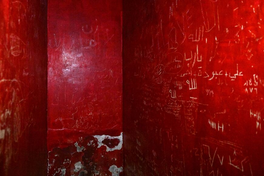 Writing on the walls of a prison cell in the basement of the Syrian General Intelligence Directorate (GID) Branch 251, also known as Al-Khatib branch, in Damascus -- some former prisoners are returning, trying to find closure