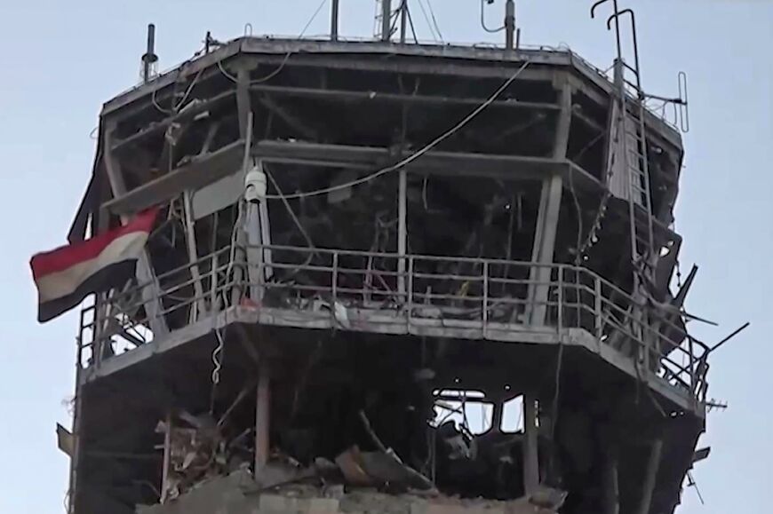 An image taken from a handout video provided by the Huthis' official Al-Masirah TV station shows the damage to the airport from an Israeli strike