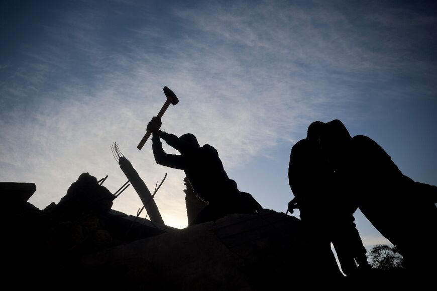 People search for survivors at the site of the strike on Deir el-Balah in the central Gaza Strip