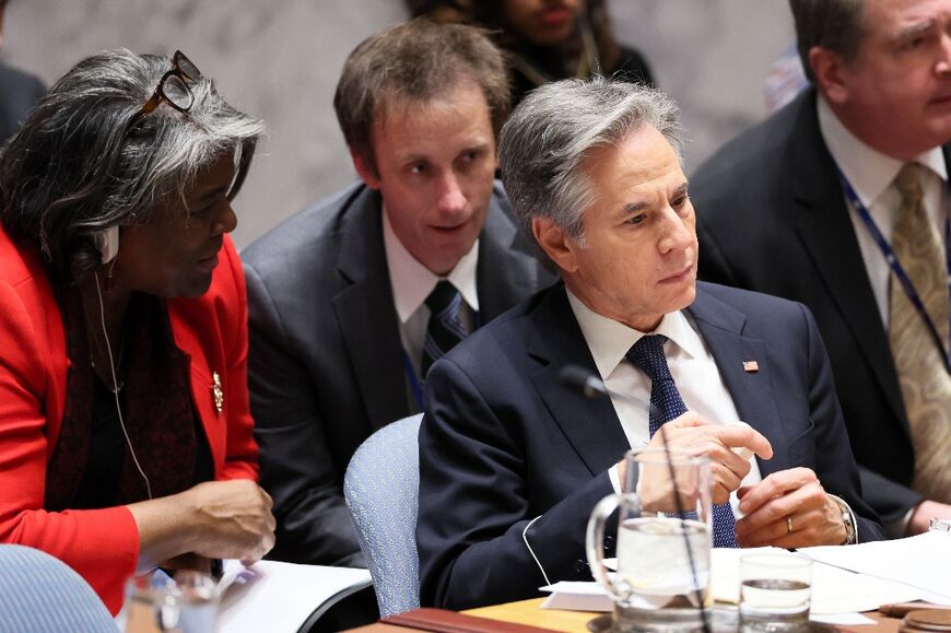 US Secretary of State Antony Blinken speaks with Ambassador Linda Thomas-Greenfield at a UN Security Council session on Sudan