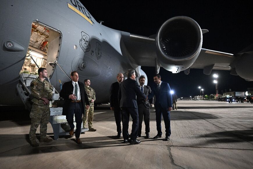 US Secretary of State Antony Blinken greets officials after arriving in Jordan's Aqaba for talks on Syria