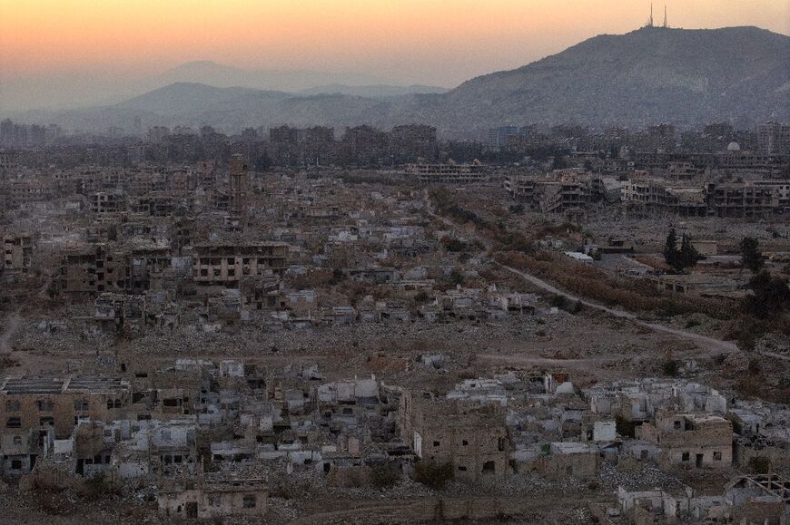 This aerial view shows destroyed buildings in the city of Harasta in Eastern Ghouta on the outskirts of Damascus