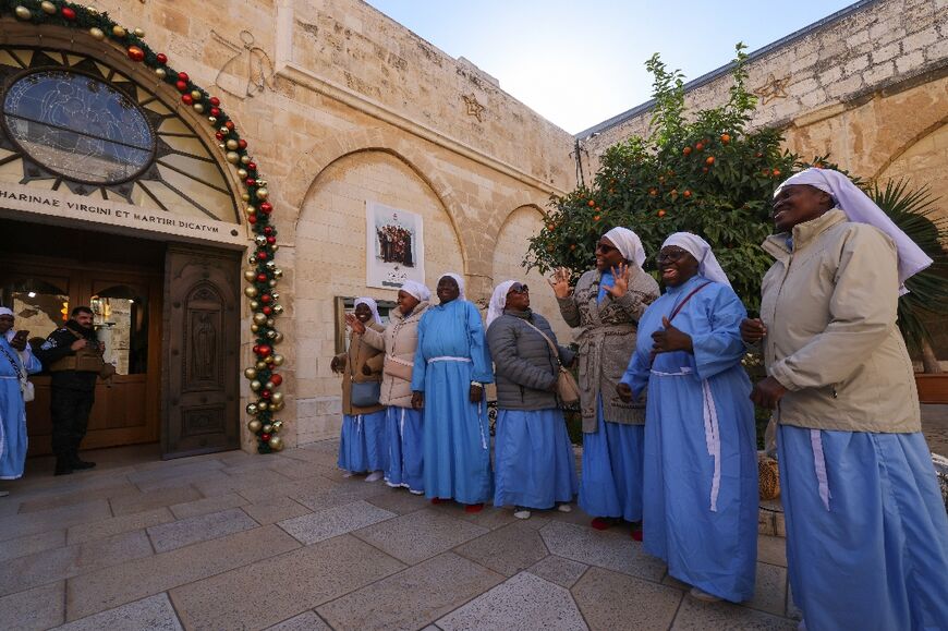 Though the crowds have largely stayed away, a few groups of pilgrims could still be seen visiting the church