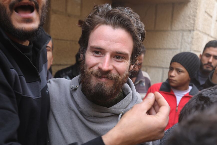 Travis Timmerman, a US citizen who had entered Syria from Lebanon on a Christian pilgrimage and had been detained for several months, speaks with reporters in a house in Damascus