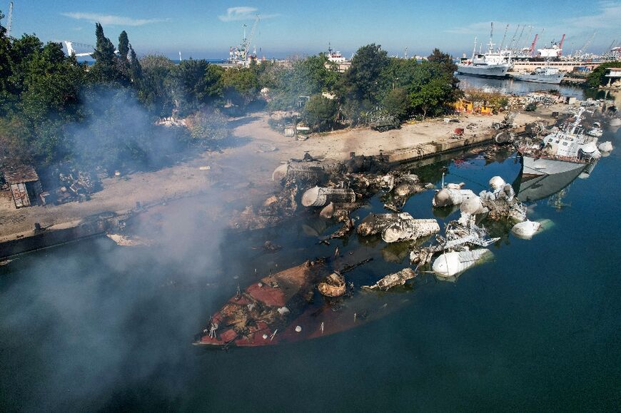 An aerial photo shows Syrian naval ships destroyed in an overnight attack on the port city of Latakia 