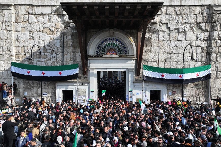 Syrians attend Friday prayers at the Umayyad Mosque in the capital Damascus