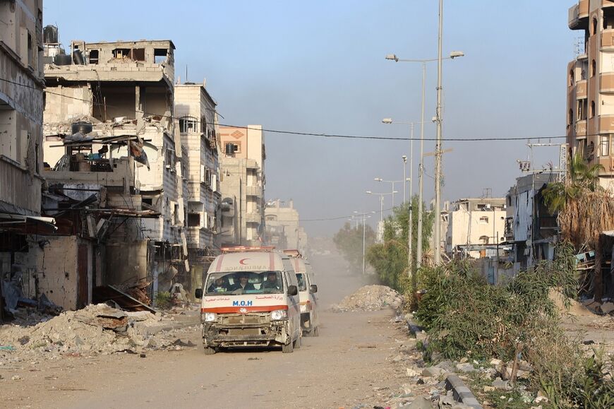 Ambulances transport wounded Palestinians from Kamal Adwan Hospital to Al-Shifa hospital in Gaza City