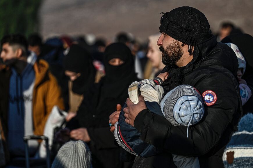 Most of those waiting at Turkey's Cilvegozu crossing were refugee families who have lived in Turkey for more than 10 years