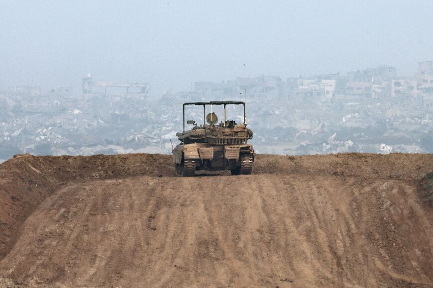 An Israeli army vehicle on a hill overlooking northern Gaza