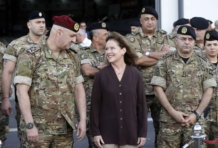 Elizabeth Richards (C), the US Ambassador to Lebanon, speaks with Lebanese Army Chief of Staff General Joseph Aoun (L) as they attend a handover ceremony organised by the Lebanese Armed Forces of four A-29 Super Tucano aircraft given by the US at Hamat airbase, north of Beirut on June 12, 2018. (Photo by JOSEPH EID / AFP) (Photo credit should read JOSEPH EID/AFP via Getty Images)