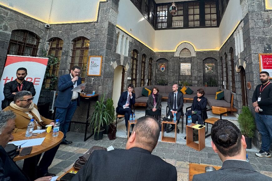 French Foreign Minister Jean-Noel Barrot (centre right), during his visit to Damascus, addresses representatives of Syria's long-repressed civil society