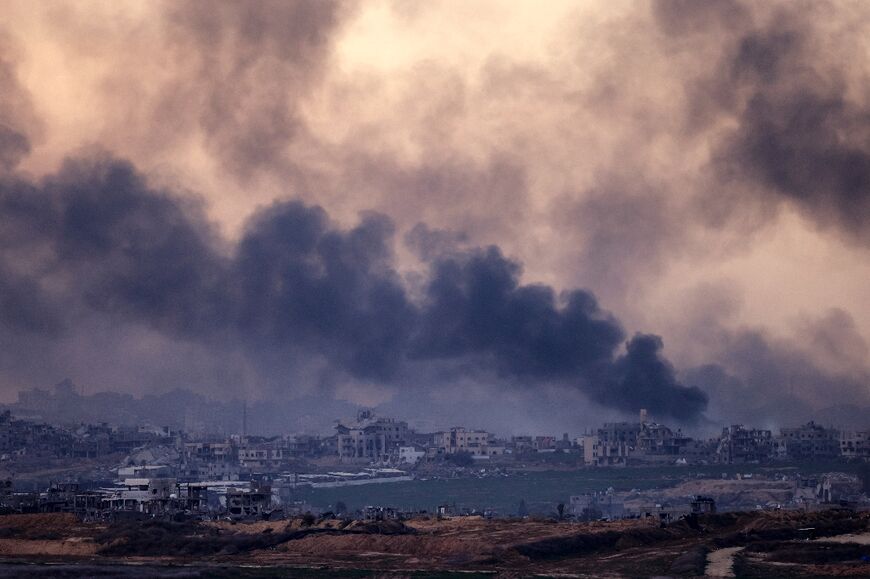 Smoke rises above destroyed buildings in the northern Gaza Strip during an Israeli army bombardment on Sunday